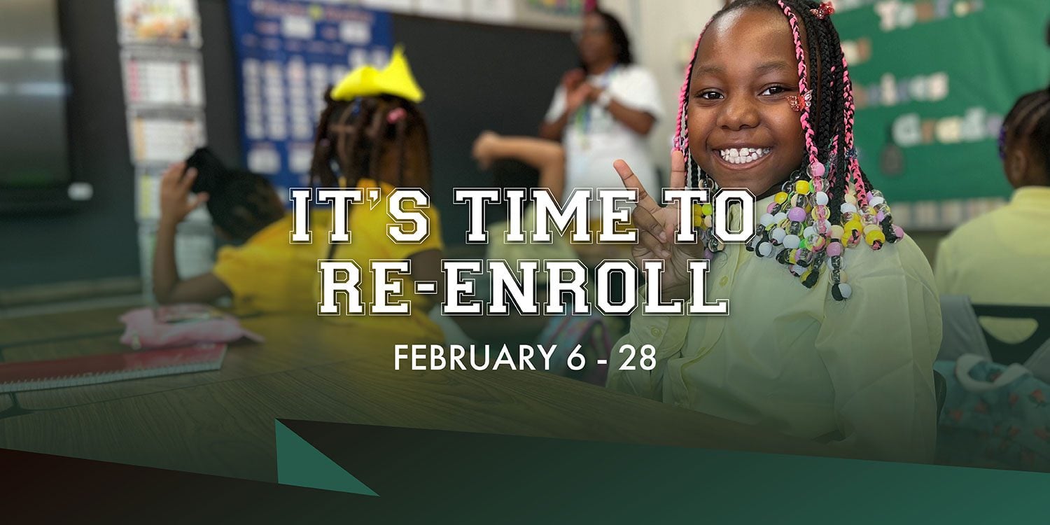 Smiling child in classroom announces re-enrollment.